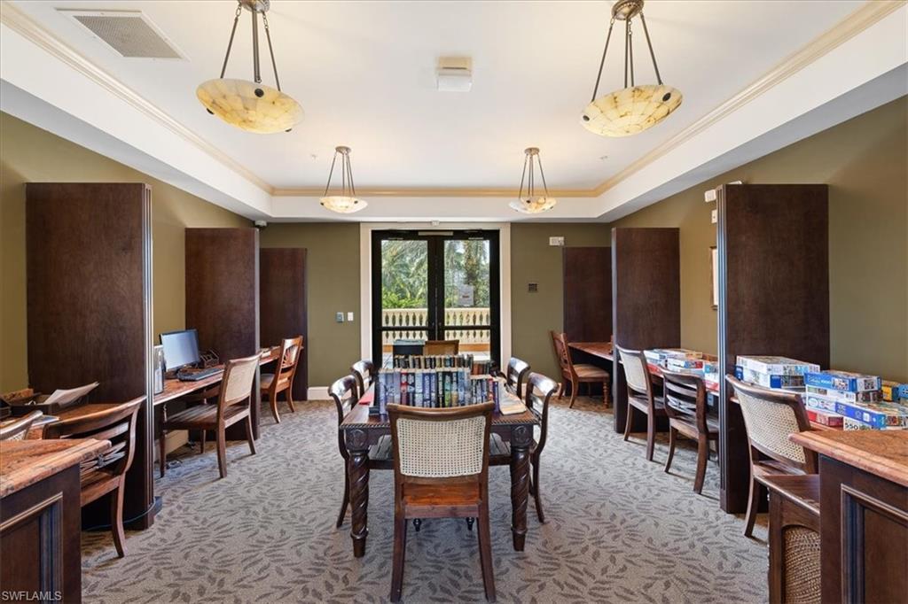8985 Cambria Circle, Unit 211 Naples, FL 34113 - Photo 36 of 41 a view of a dining room with furniture