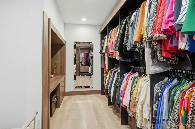 a view of a hallway with the wooden floor and staircase