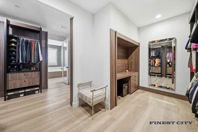 a bedroom with a bed and dresser