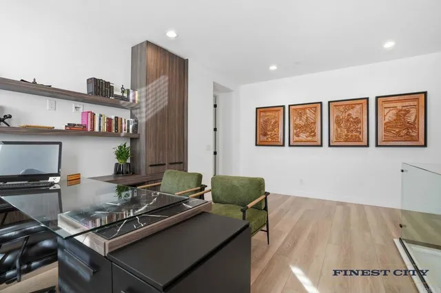 a view of a chair and tables in the patio