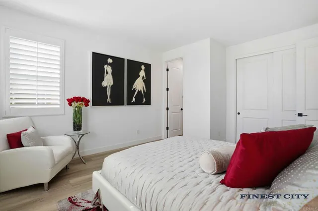 a view of a patio with table and chairs potted plants with wooden fence