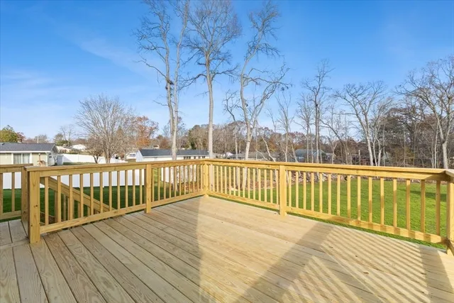 a view of balcony with wooden floor