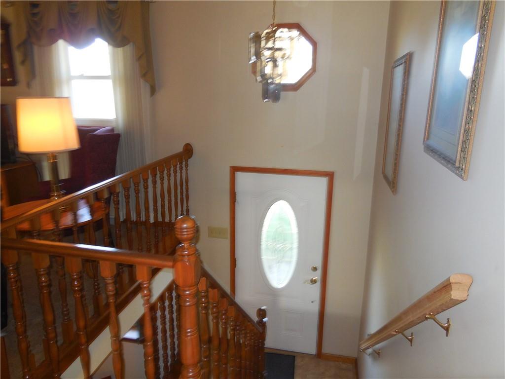 4575 Tuscarawas Road Beaver, PA 15009 - Photo 8 of 24 a view of a hallway with wooden floor and staircase