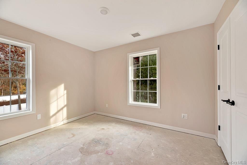 514 Neighborhood Road Shirley, NY 11967 - Photo 10 of 20 an empty room with windows
