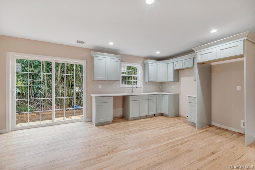 514 Neighborhood Road Shirley, NY 11967 - Photo 4 of 20 a kitchen with a refrigerator and window