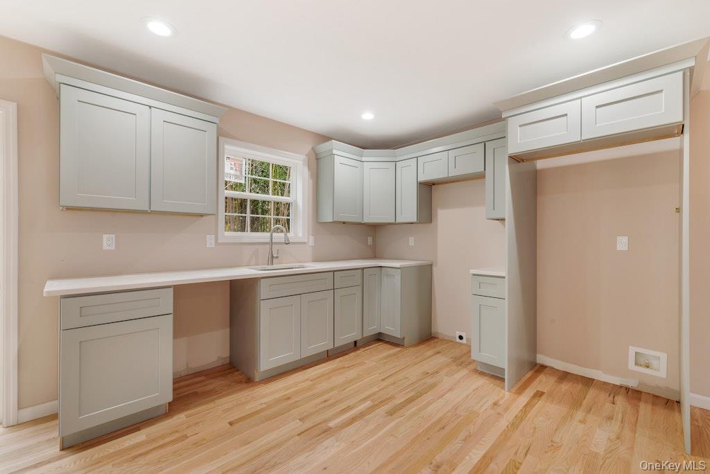 514 Neighborhood Road Shirley, NY 11967 - Photo 5 of 20 a kitchen with granite countertop white cabinets and white appliances