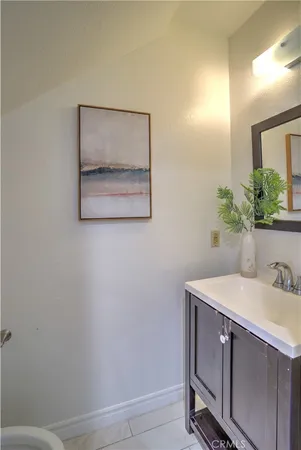 a bathroom with a sink a vanity and a mirror