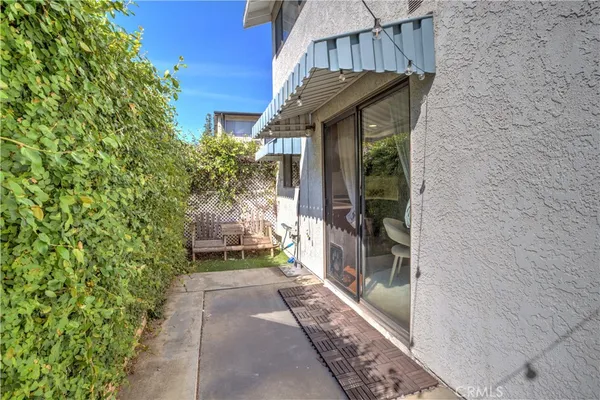 a path view of a house with a yard