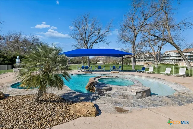 a view of a park with large trees