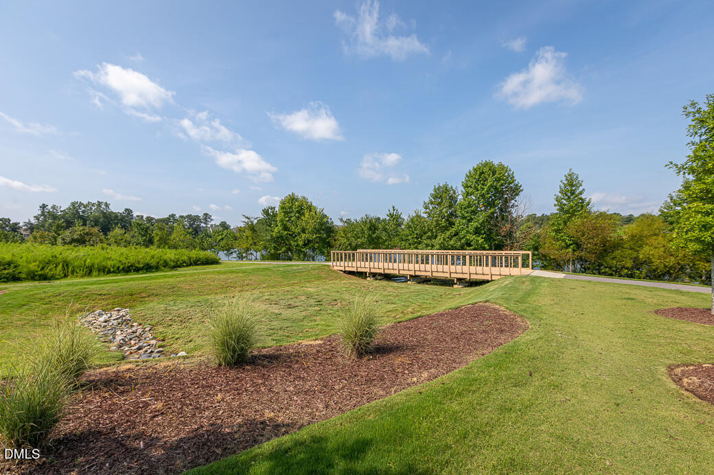 1708 Highpoint Street Wake Forest, NC 27587 - Photo 49 of 63 a view of a golf course with a lake