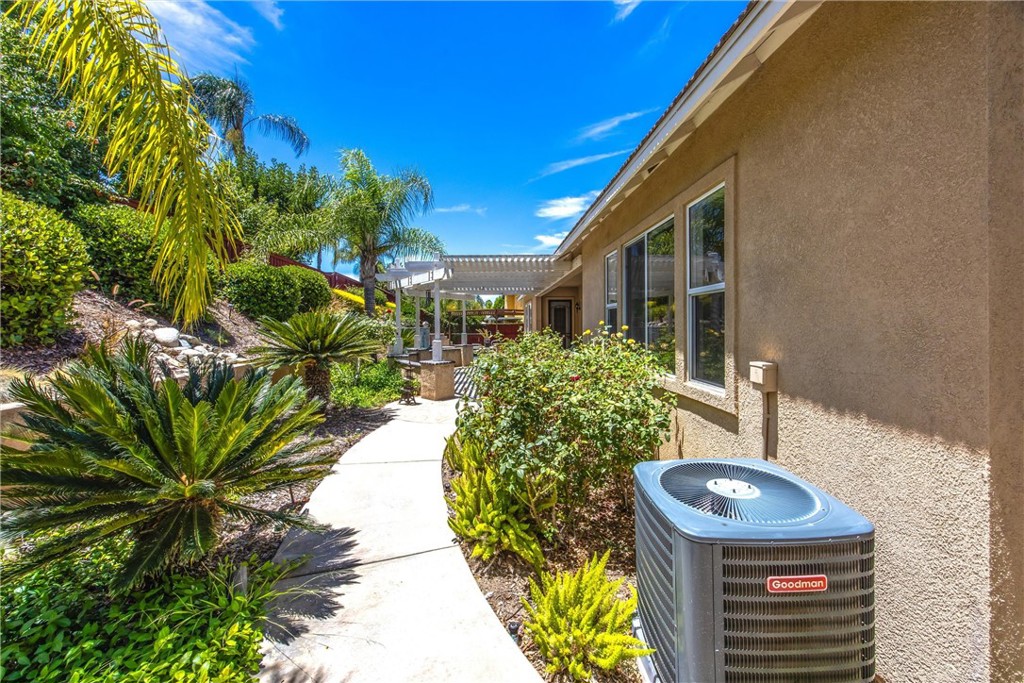 8710 Windmill Place Riverside, CA 92508 - Photo 59 of 66 a front view of a house with a yard