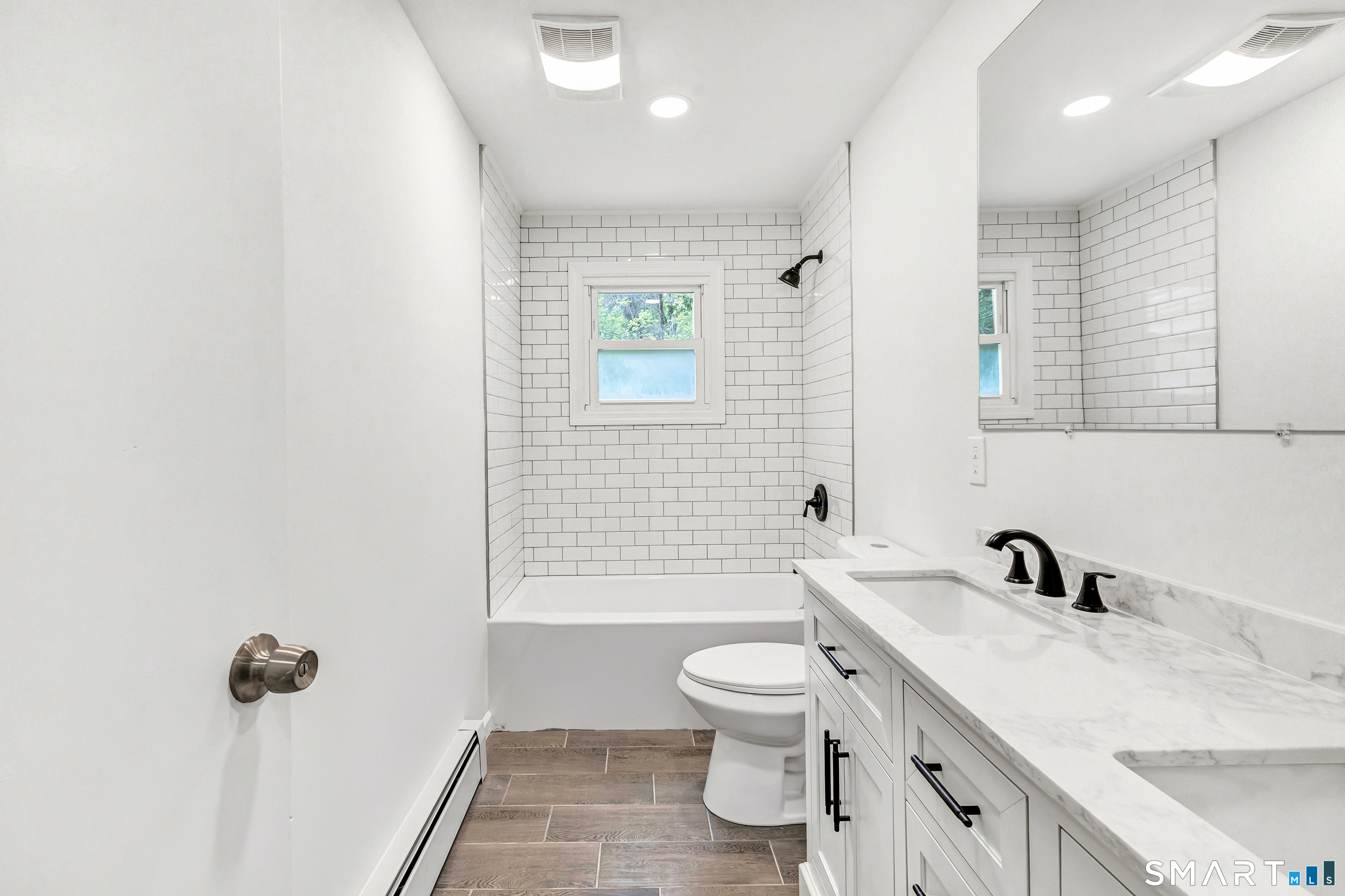 7 Longview Road Newtown, CT 06482 - Photo 20 of 40 a bathroom with a sink a toilet and shower