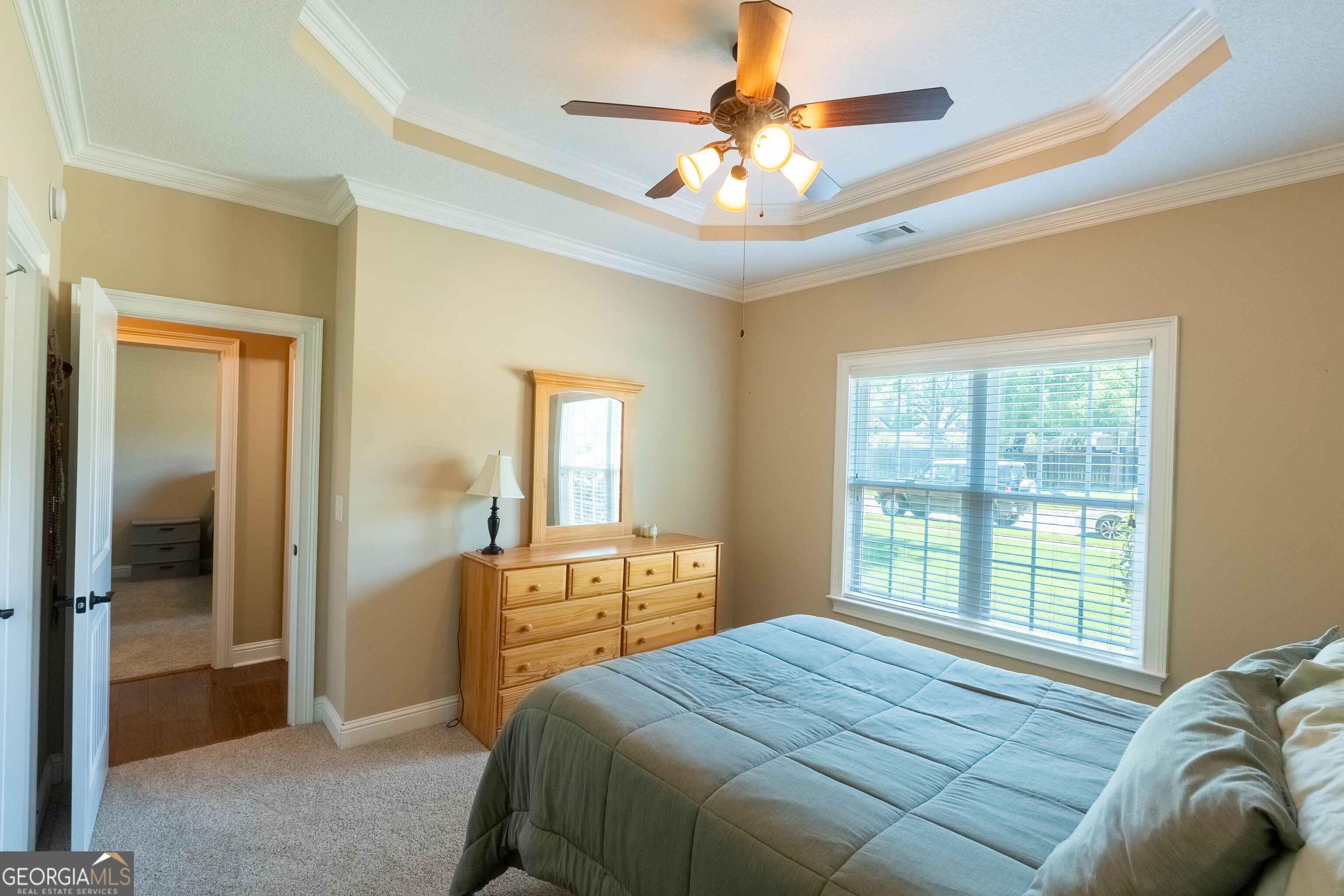 501 Old Bridge Road Warner Robins, GA 31088 - Photo 26 of 54 a bedroom with a bed and a chandelier