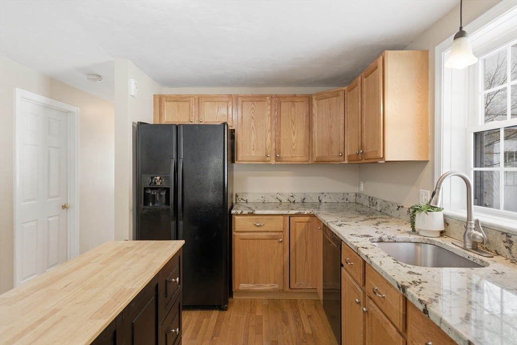 318 Old Mill Road Barnstable, MA 02648 - Photo 12 of 36 a kitchen with a sink a refrigerator and cabinets