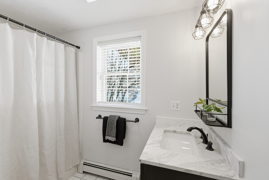 318 Old Mill Road Barnstable, MA 02648 - Photo 16 of 36 a bathroom with a sink and a window