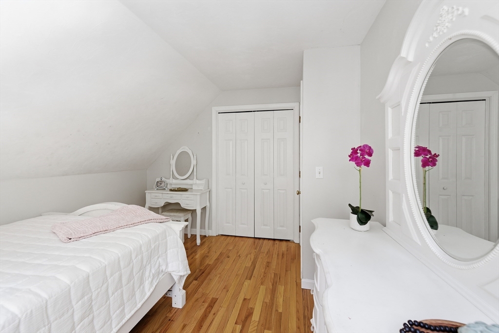 318 Old Mill Road Barnstable, MA 02648 - Photo 26 of 36 a bedroom with a bed and wooden floor