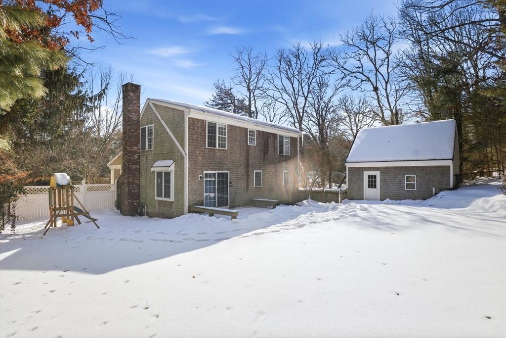 318 Old Mill Road Barnstable, MA 02648 - Photo 29 of 36 a front view of a house with a yard