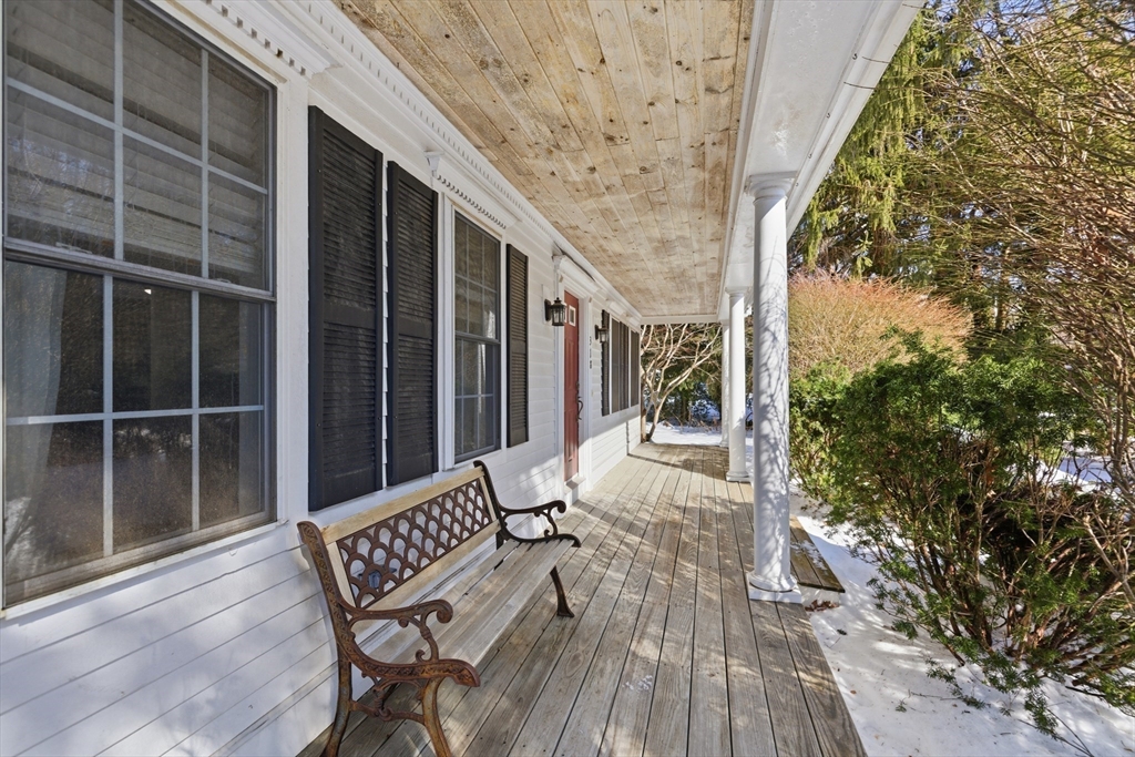 318 Old Mill Road Barnstable, MA 02648 - Photo 3 of 36 a balcony with furniture and wooden floor