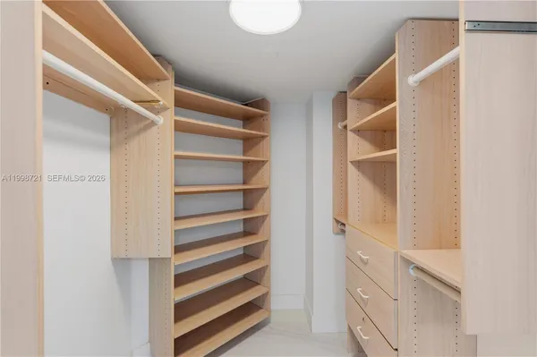 a spacious bathroom with a double vanity sink and a mirror