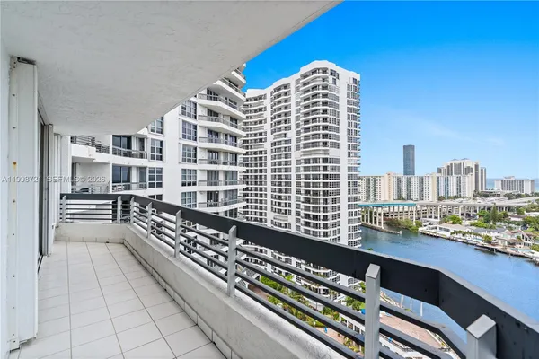 a view of a swimming pool with outdoor seating