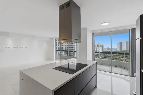 a kitchen that has a refrigerator a stove and a sink