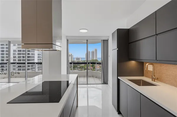a kitchen with a refrigerator and cabinets