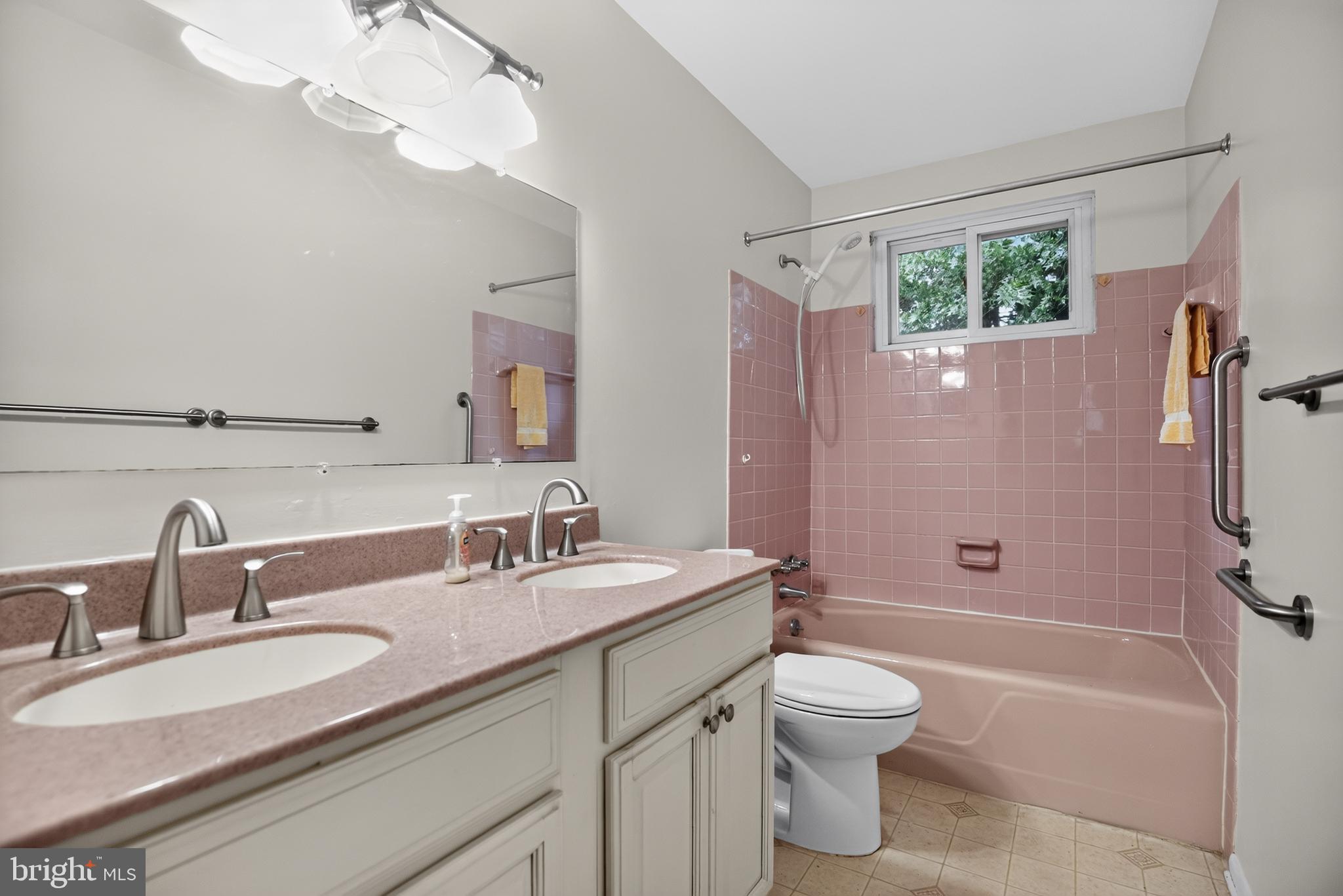 26 Glenwood Road Lumberton, NJ 08048 - Photo 19 of 37 Charming pink-tiled bathroom oasis.
