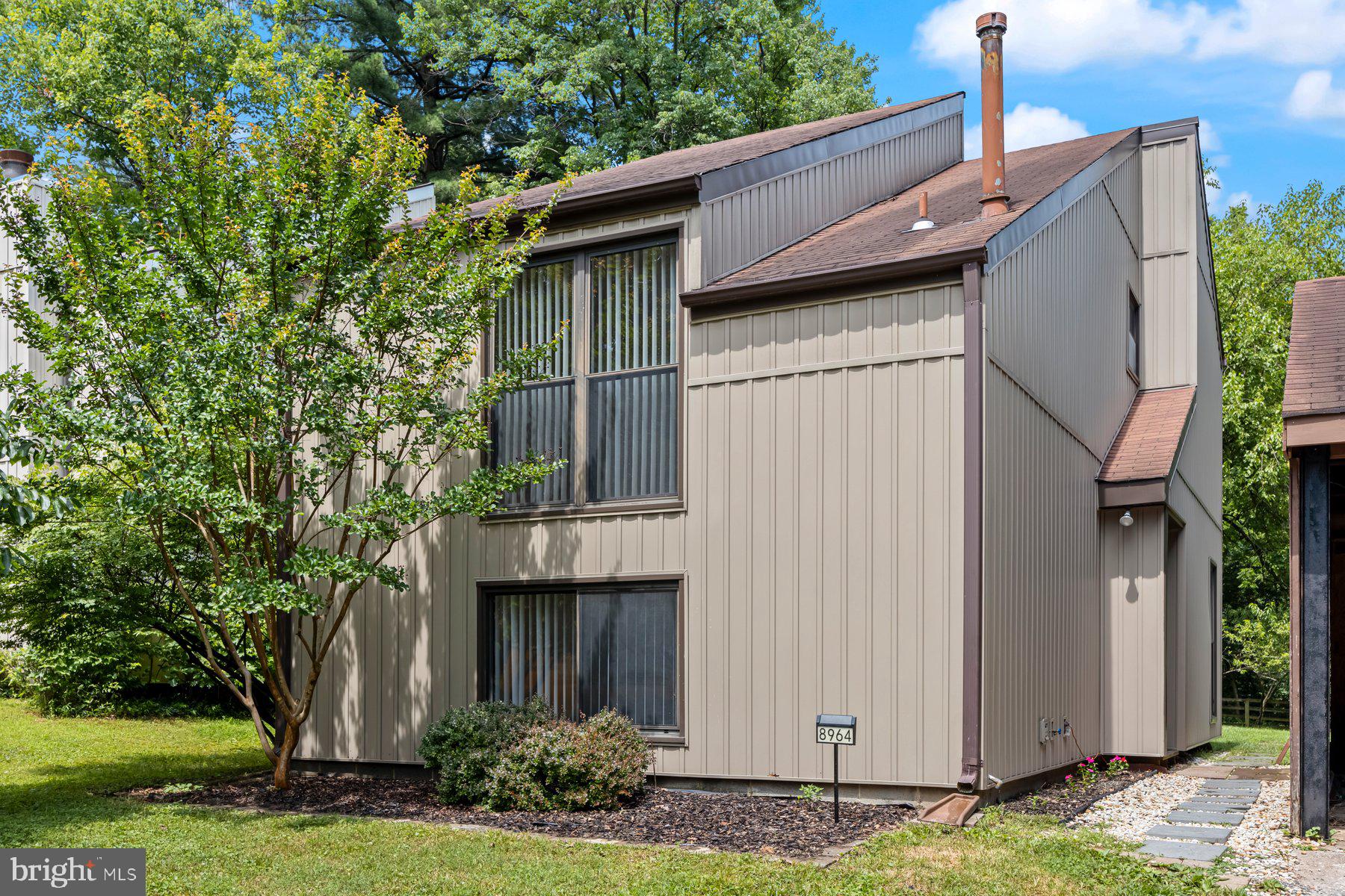 8964 Blue Pool Columbia, MD 21045 - Photo 2 of 36 a house view with a garden space