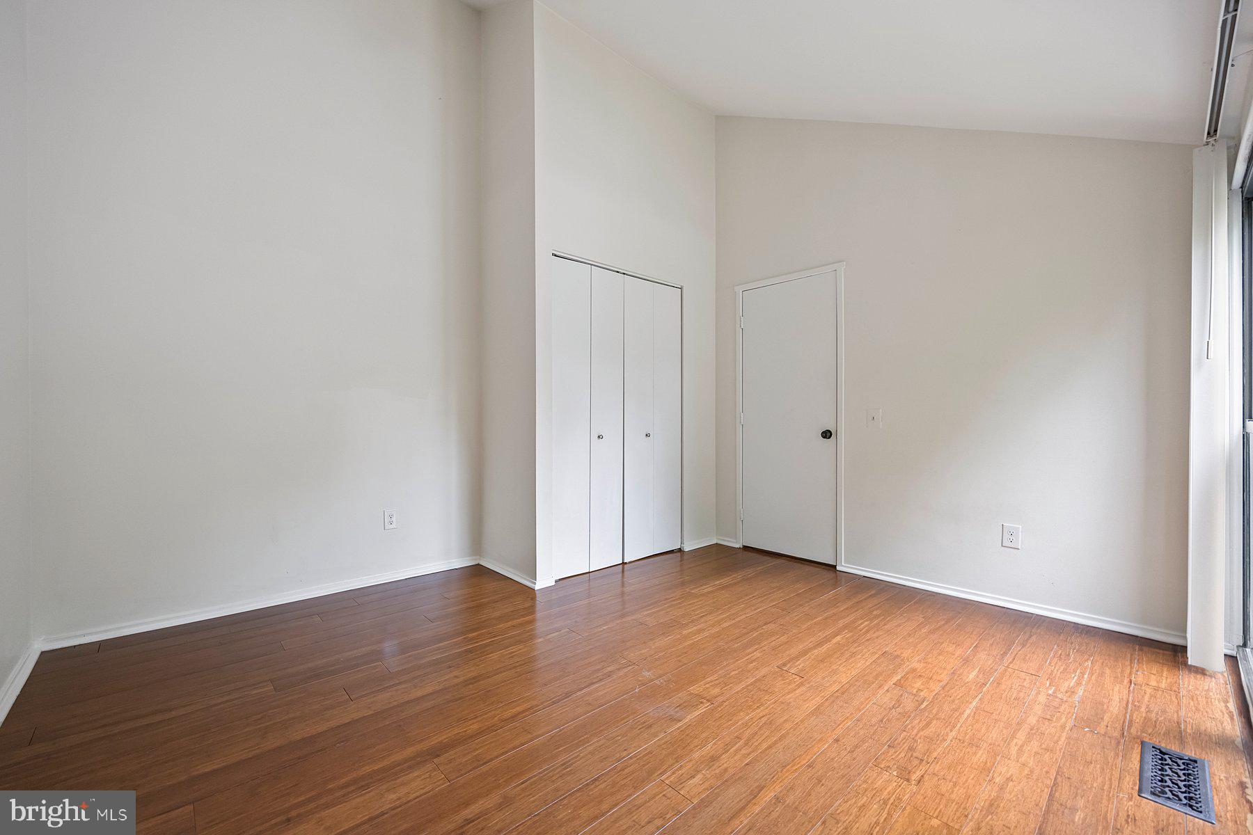 8964 Blue Pool Columbia, MD 21045 - Photo 26 of 36 a view of an empty room with wooden floor