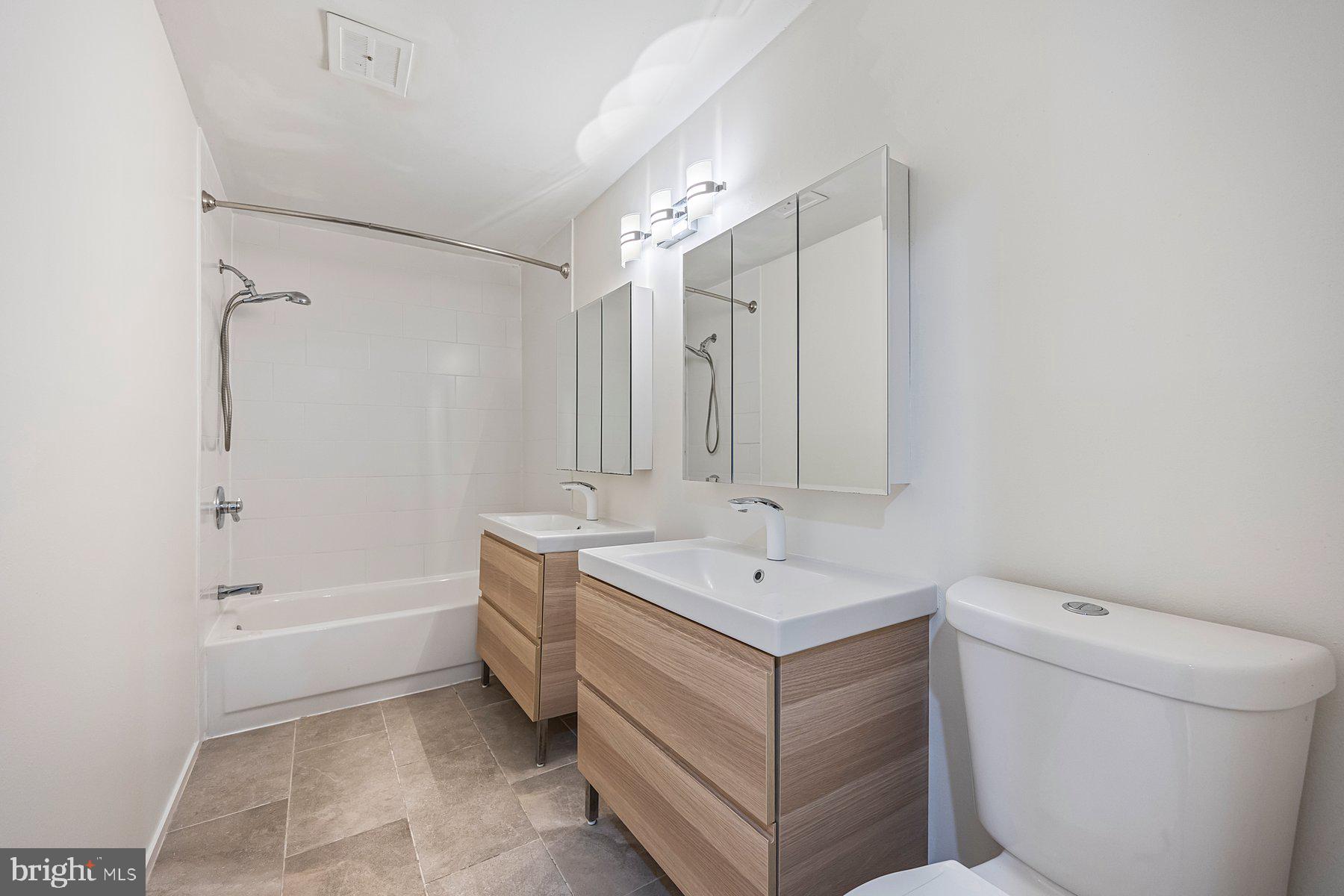 8964 Blue Pool Columbia, MD 21045 - Photo 27 of 36 a bathroom with a sink a toilet and shower