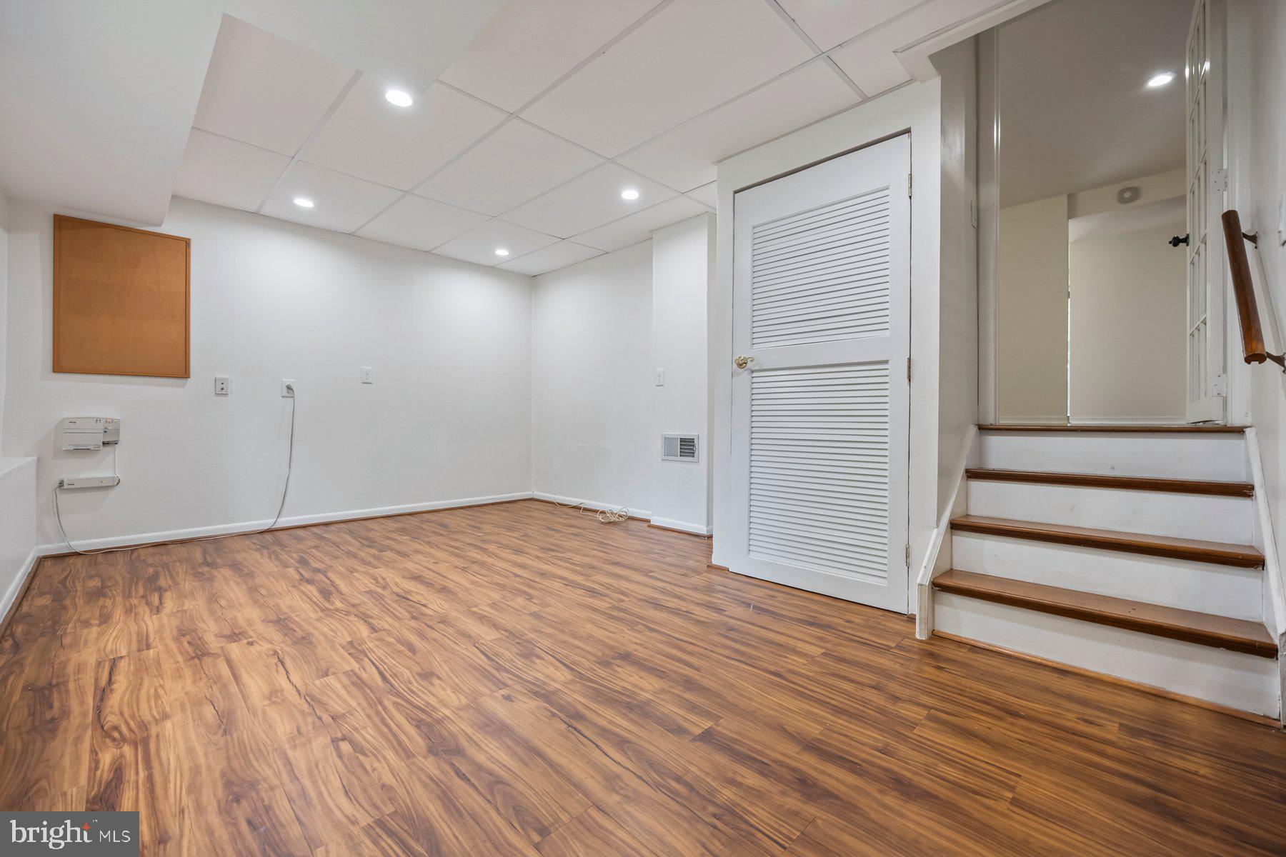 8964 Blue Pool Columbia, MD 21045 - Photo 35 of 36 a view of a hallway with wooden floor and closet