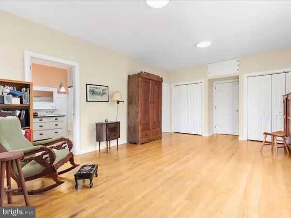 a living room with furniture a table and a large window
