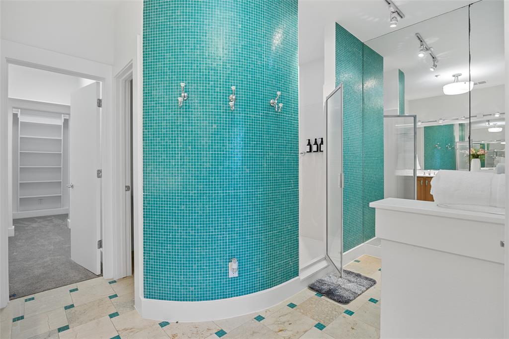 4312 McKinney Avenue, Unit 4 Dallas, TX 75205 - Photo 13 of 34 Bathroom featuring walk in shower, vanity, track lighting, and a spacious closet