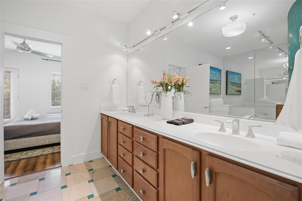 4312 McKinney Avenue, Unit 4 Dallas, TX 75205 - Photo 14 of 34 Ensuite bathroom with double vanity and ceiling fan