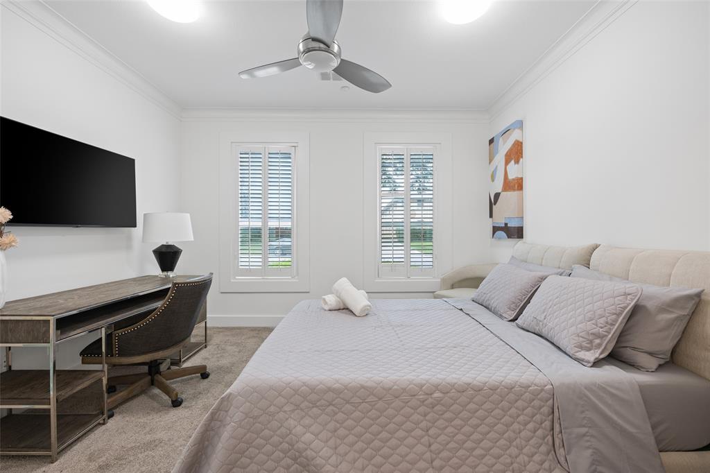 4312 McKinney Avenue, Unit 4 Dallas, TX 75205 - Photo 20 of 34 Bedroom featuring carpet floors, crown molding, a desk, and ceiling fan