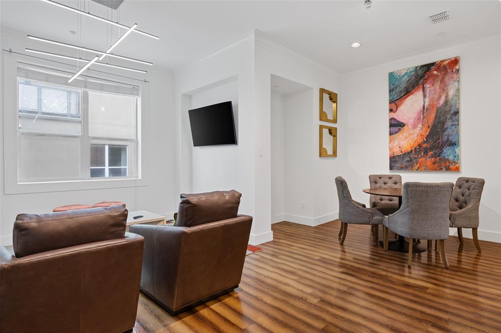 4312 McKinney Avenue, Unit 4 Dallas, TX 75205 - Photo 23 of 34 Living area featuring wood finished floors, recessed lighting, and crown molding
