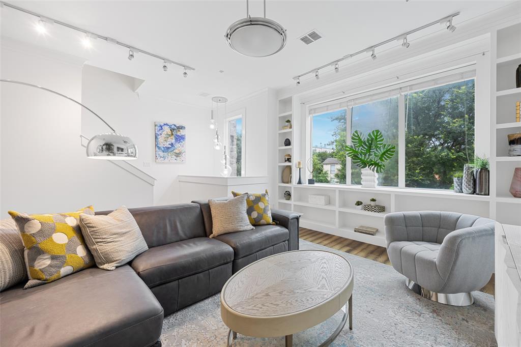 4312 McKinney Avenue, Unit 4 Dallas, TX 75205 - Photo 26 of 34 Living area with track lighting, built in features, and wood finished floors