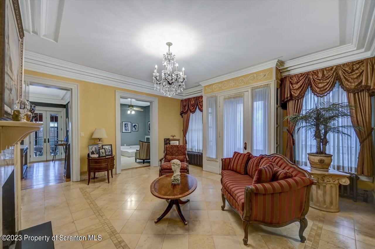 1000 Clay Avenue Scranton, PA 18510 - Photo 11 of 90 a living room with furniture and a chandelier