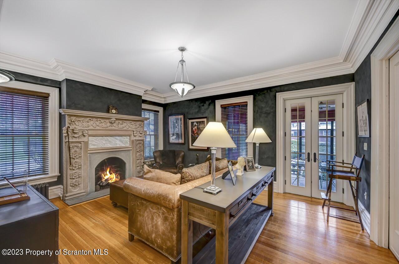 1000 Clay Avenue Scranton, PA 18510 - Photo 15 of 90 a living room with furniture a fireplace and a flat screen tv