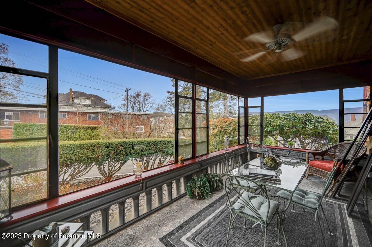 1000 Clay Avenue Scranton, PA 18510 - Photo 20 of 90 a view of a porch with furniture and wooden floor