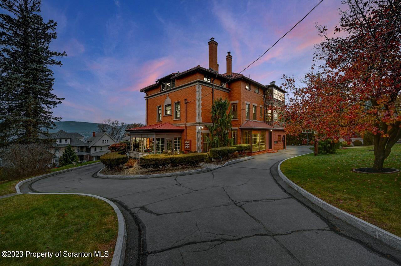 1000 Clay Avenue Scranton, PA 18510 - Photo 2 of 90 a front view of a house with a garden