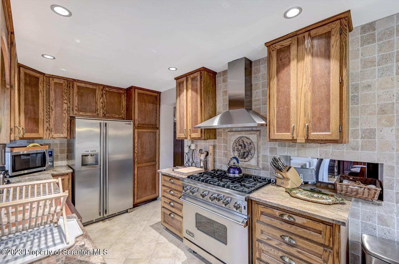 1000 Clay Avenue Scranton, PA 18510 - Photo 24 of 90 a kitchen with stainless steel appliances granite countertop a stove a sink and a refrigerator