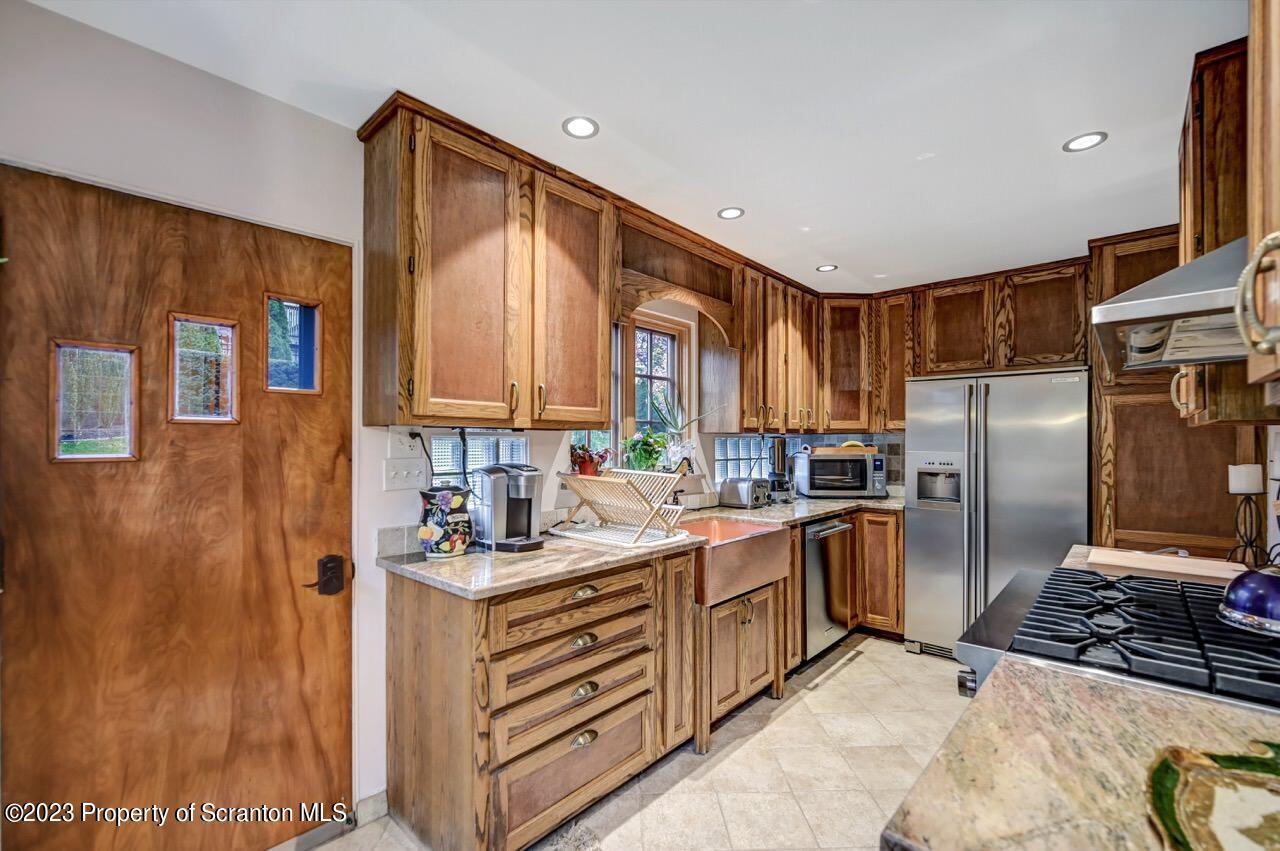 1000 Clay Avenue Scranton, PA 18510 - Photo 26 of 90 a kitchen with stainless steel appliances granite countertop a refrigerator and a stove top oven