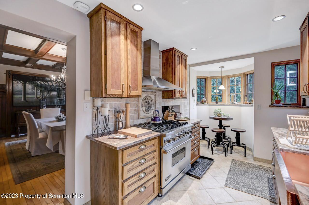 1000 Clay Avenue Scranton, PA 18510 - Photo 27 of 90 a kitchen that has a lot of cabinets in it and a large window