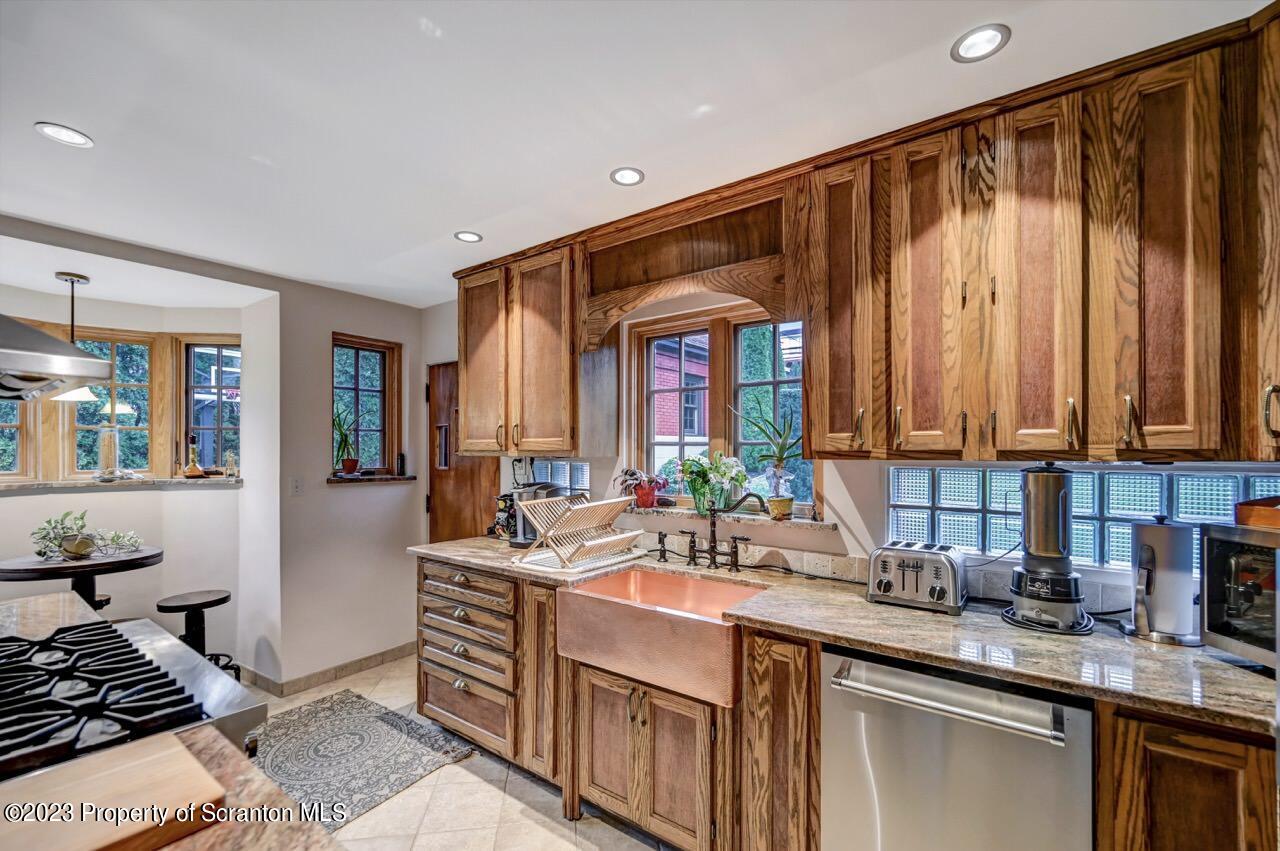 1000 Clay Avenue Scranton, PA 18510 - Photo 28 of 90 a kitchen with a sink stove and cabinets