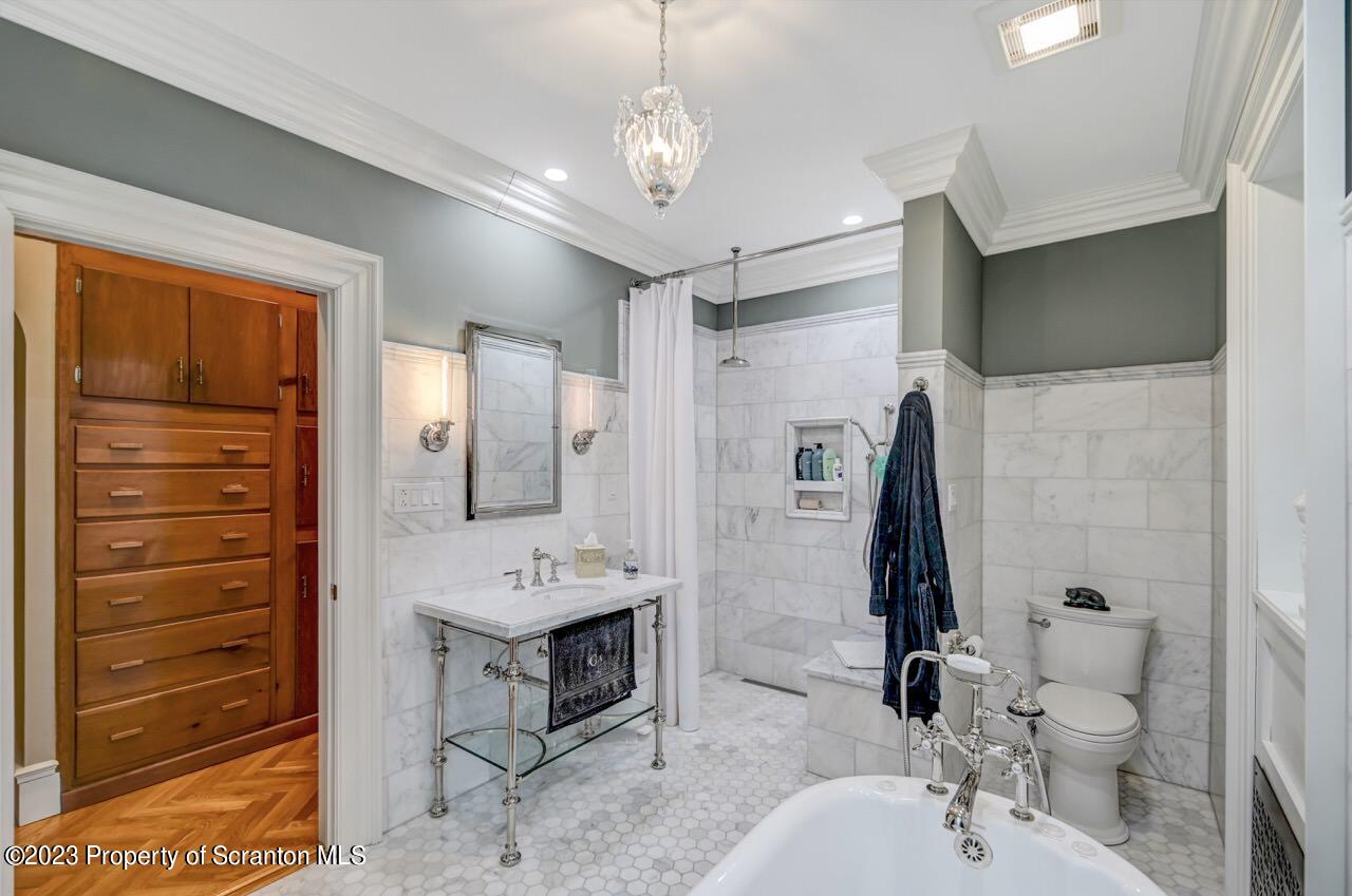 1000 Clay Avenue Scranton, PA 18510 - Photo 30 of 90 a bathroom with a sink a toilet a mirror and shower