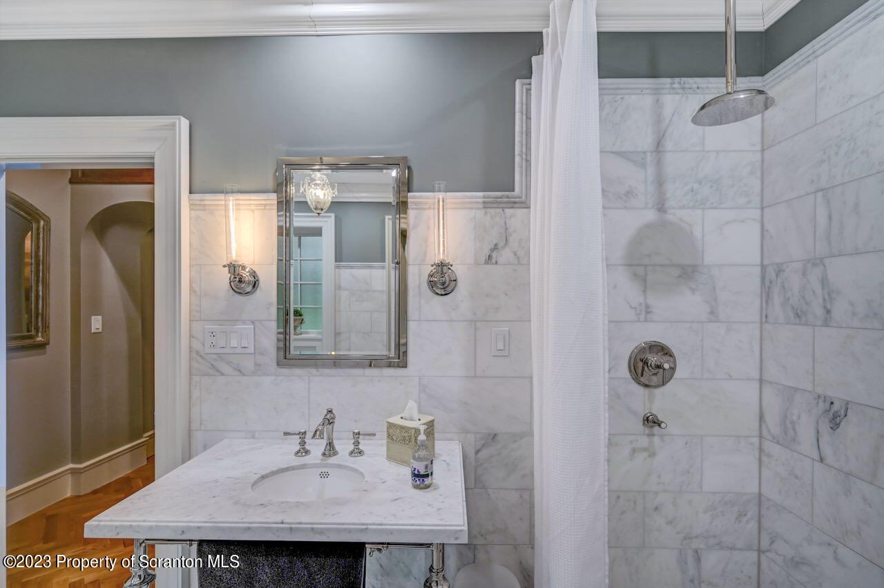 1000 Clay Avenue Scranton, PA 18510 - Photo 33 of 90 a bathroom with a sink a mirror and shower
