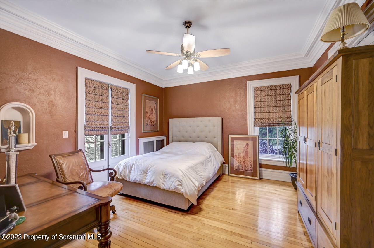 1000 Clay Avenue Scranton, PA 18510 - Photo 37 of 90 a bedroom with a bed wooden floor and window