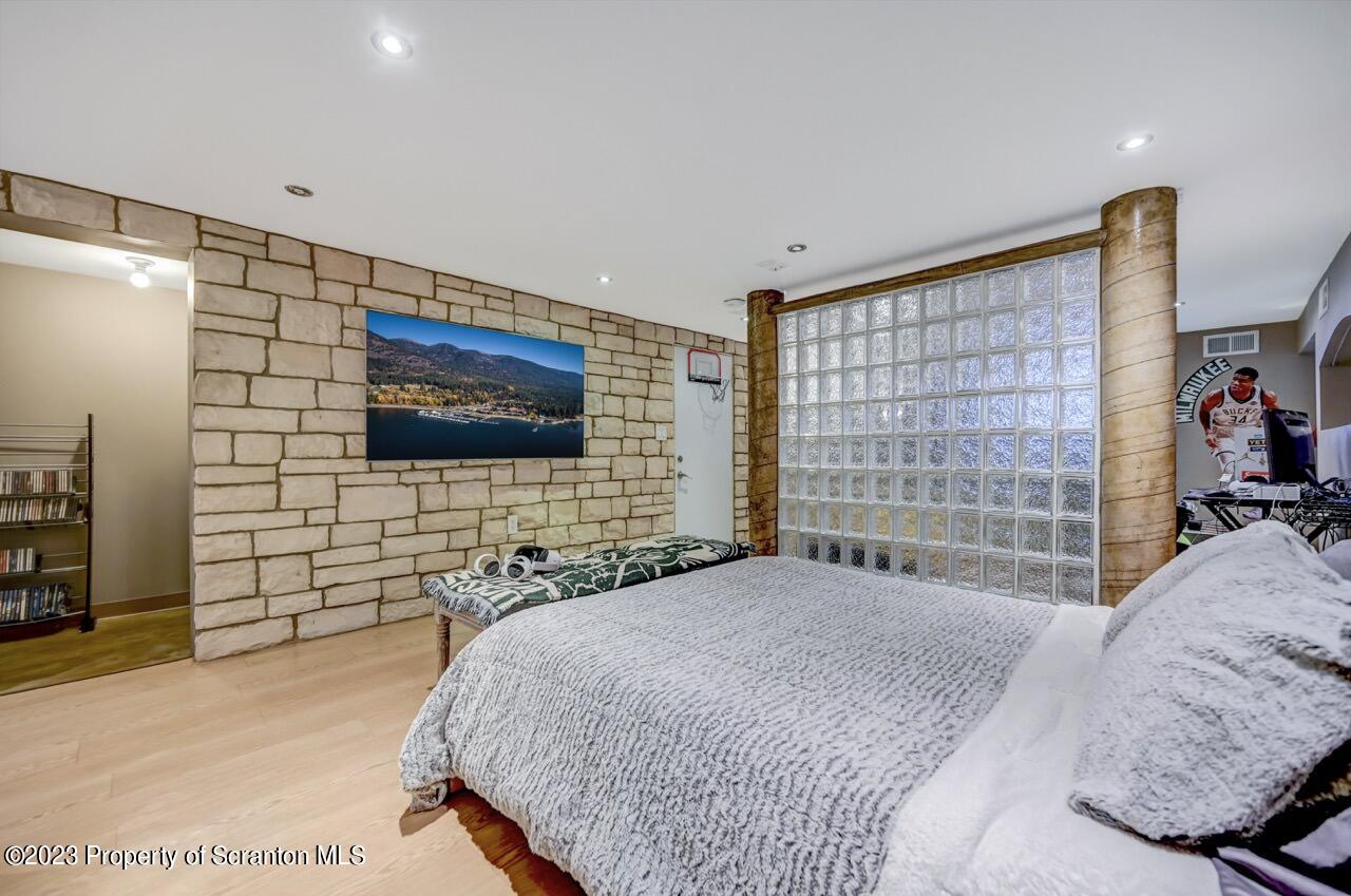 1000 Clay Avenue Scranton, PA 18510 - Photo 45 of 90 a bedroom with a bed and a flat screen tv