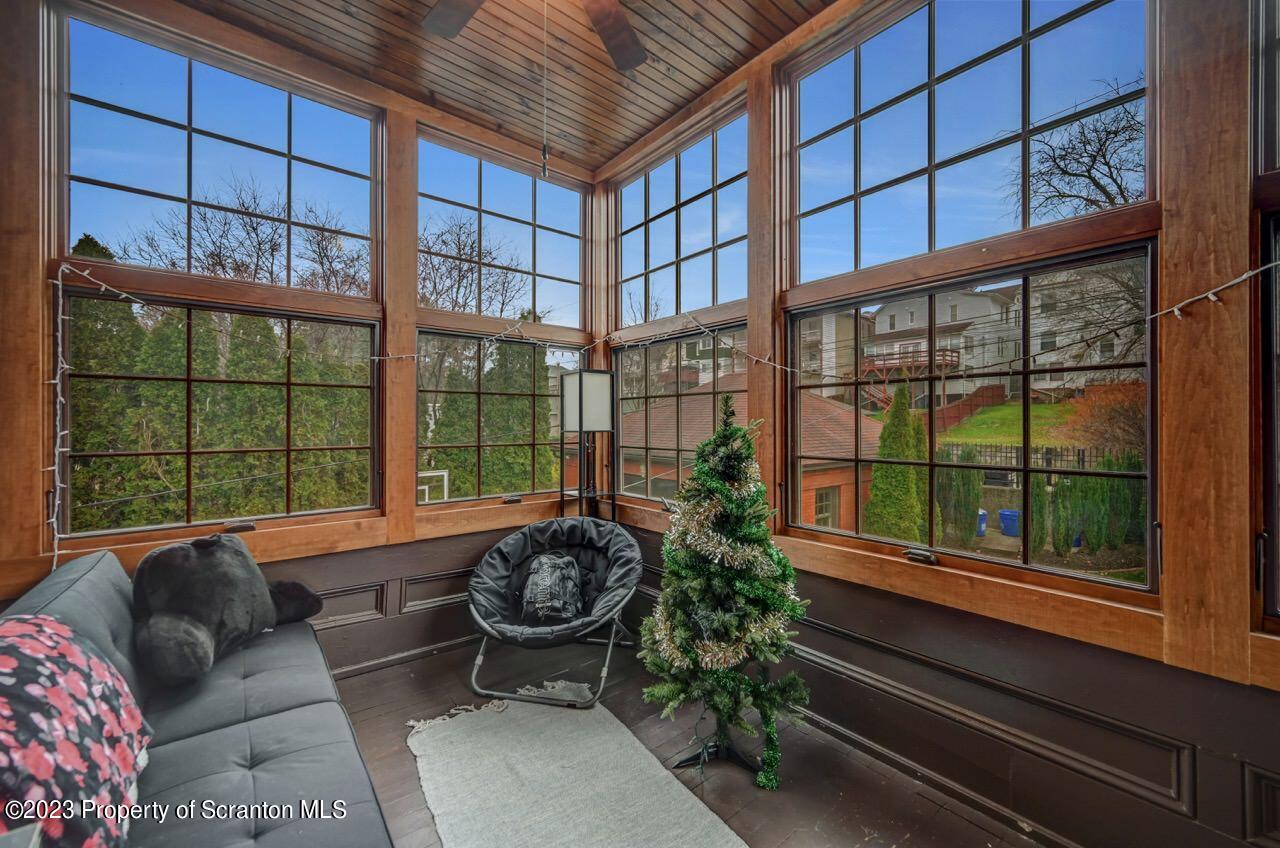 1000 Clay Avenue Scranton, PA 18510 - Photo 57 of 90 a living room filled with furniture and a potted plant